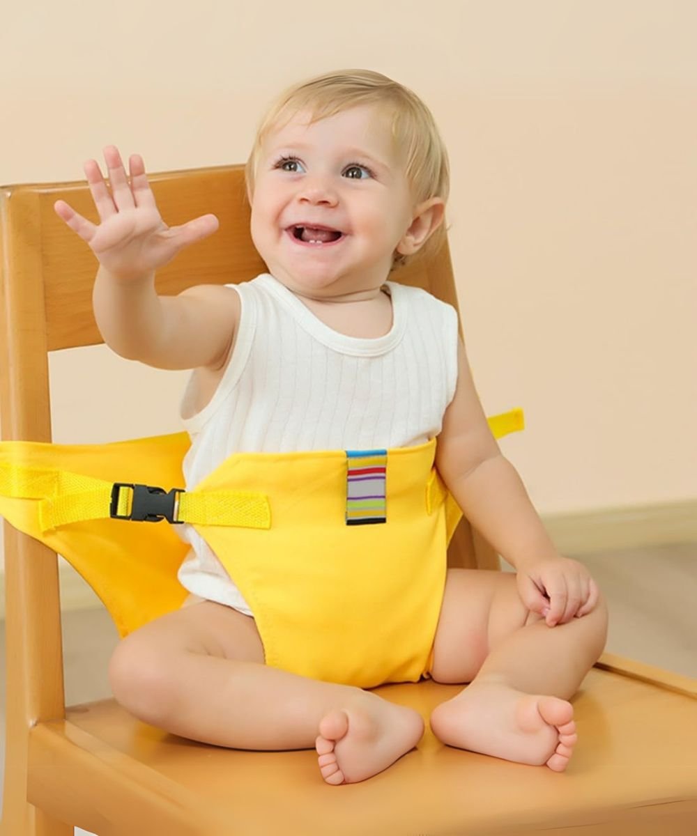 Baby sitting on a dining chair using a portable baby chair harness